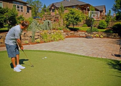 86 Res Outdoor Entertaining Space with Pavers Synthetic Turf and Natural Boulder Walls 2