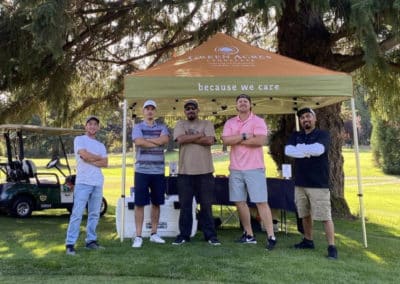 Community Page Employees at Golf Tourney